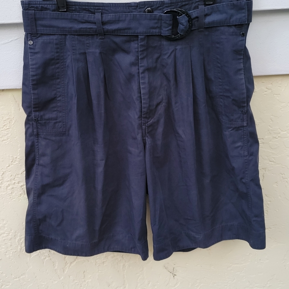 LOUIS VUITTON black shorts with an attached belt.
